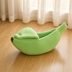 Cama Cálida con forma de plátano para mascotas.